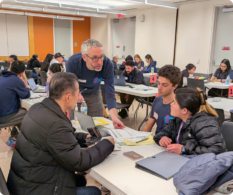 Attorney reviews SFPCI workshop participant's naturalization application